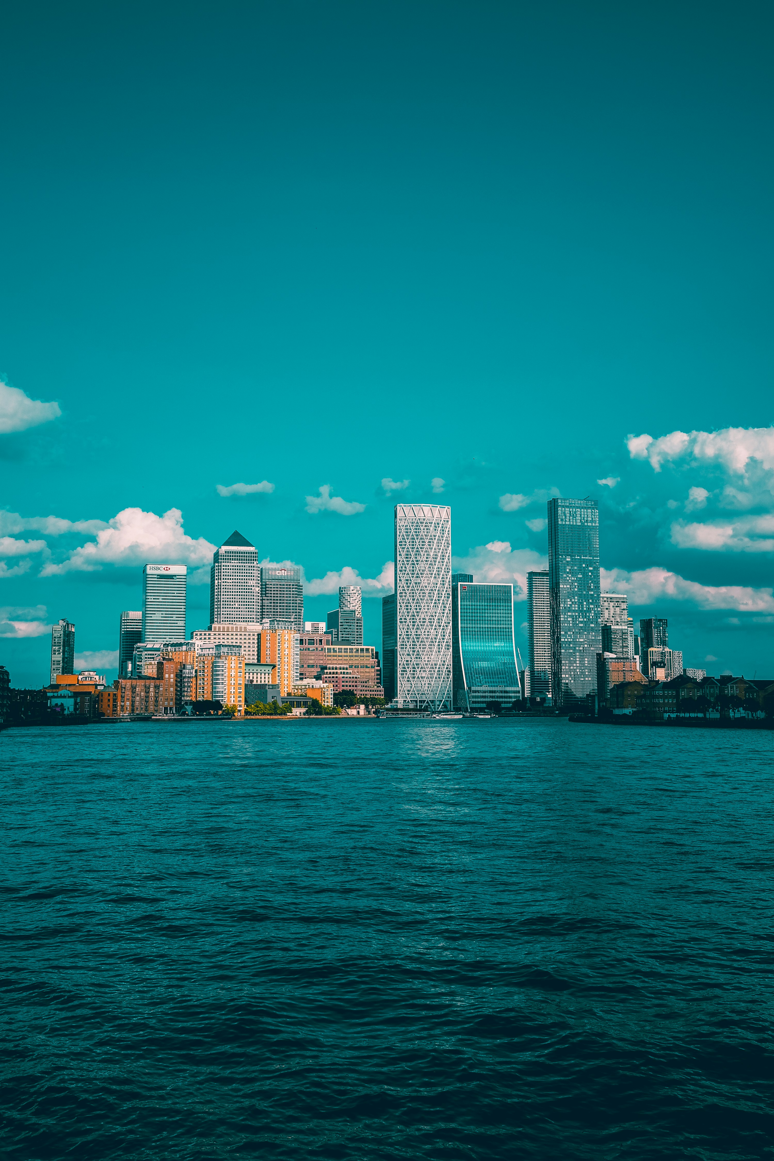 The Canary Wharf skyline rising above the docks and waterfront.