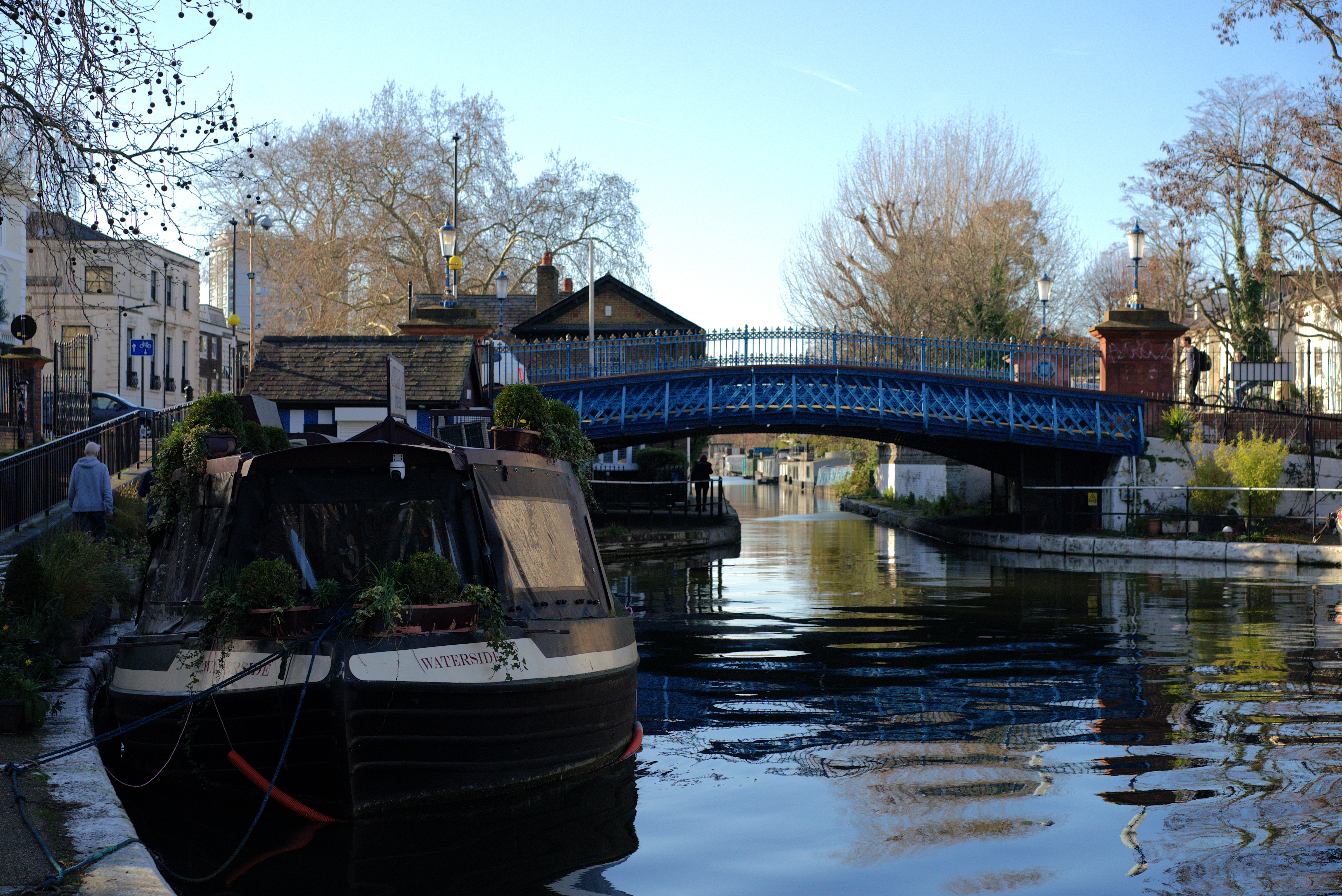 Canal boats, waterside greenery and buildings around Little Venice near Paddington.
